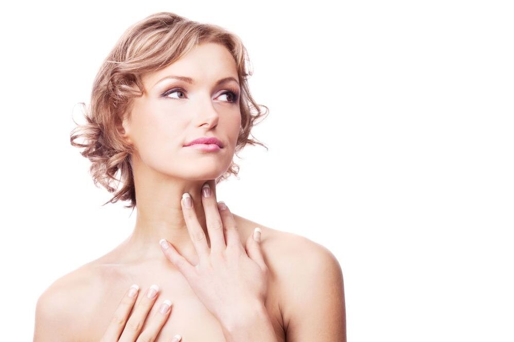 A girl with smooth skin of the neck and décolleté after rejuvenation procedures